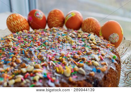 Easter Cake And Colored Eggs With Colorful Decoration On Holyday Happy