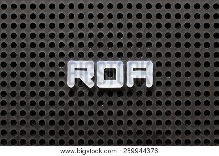 Black Color Pegboard With White Letter In Word Roa (abbbreviation Of Return On Assets)