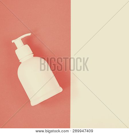 White Plastic Dispenser Mock Up Bottle On The Empty Devided Into Two Parts Background With Copy Spac
