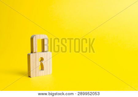 A Padlock On A Yellow Background. Information Safty. Concept Of The Preservation Of Secrets, Informa
