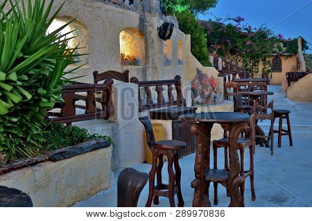 Old-style Cafe With Wooden Tables And Chairs
