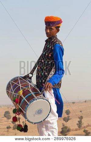 Indian Drummer In Traditional Clothes. Rajasthan, India