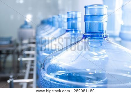 Water Bottling Line For Processing And Bottling Pure Spring Water Into Small Bottles. Selective Focu