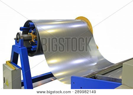 Roll Of Galvanized Steel Sheet For Manufacturing Metal Pipes And Tubes In The Factory.