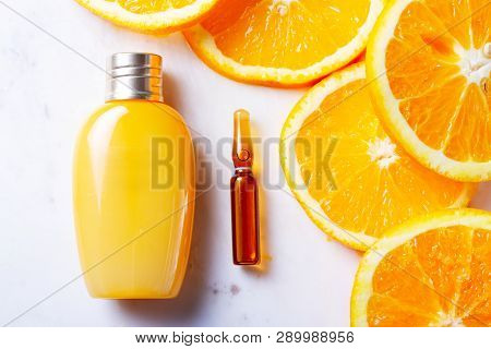 Vitamin C, Natural Anti Aging Cosmetics Cream Bottle And Serum Ampula With Fruits
