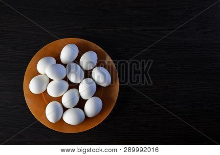 Easter Eggs On The Plate. Festive Meal On A Dark Wooden Table. Feast Of Holy Easter.