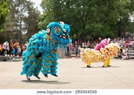 Columbus, Ohio, USA - May 27, 2018  Members of the Tay Phuong Monastery perform a lion dance at the Asian Festival.