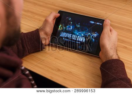 Prague, Czech Republic - March 16, 2019: Man Holding A Smartphone And Playng The Minecraft Mobile Ga