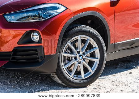 Madrid, Spain - March 16, 2019: Close Up View Of Headlight And Tire Of New Bmw X2 Orange Painted