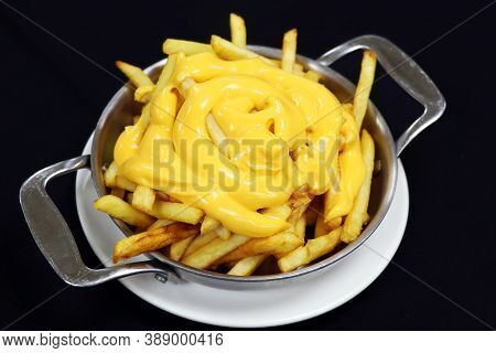 Melted Cheese On French Frice Knoen As Cheesy Fries