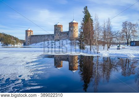 View Of The Ancient Fortress Olafsborg (olavinlinna) On A Sunny March Day. Savonlinna, Finland