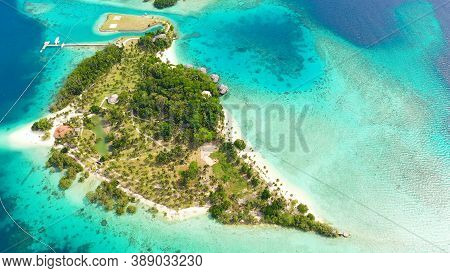 Island With Beautiful Beach, Palm Trees By Turquoise Water View From Above. Malipano Island, Philipp