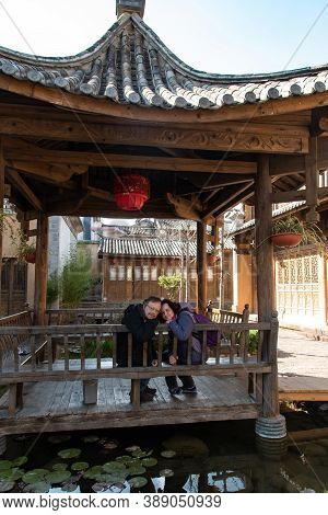February 2019. Shaxi. Italian Tourists Visit The City. Halfway Between Dali And Lijiang, Between The