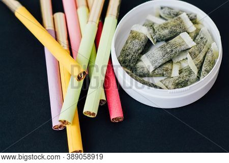 Round Box Of Snus With Multicolored Cigarettes Cigarette Substitute, Nicotine Pouches.