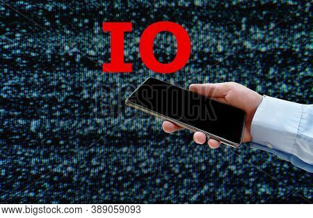 Red Letter Io Or Information Operation Over Smart Phone In Businessman Hand On Glith Background