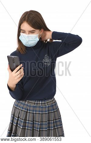 Pre-adolescent Girl Holding Black Smartphone. Isolated On White Background. High Resolution Photo. F