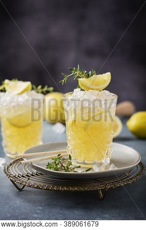 Cocktail With Lemon, Timo And Crushed Ice
