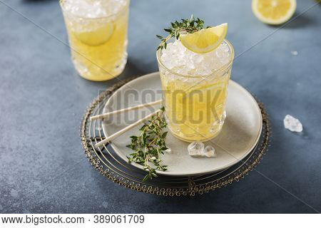 Cocktail With Lemon, Timo And Crushed Ice