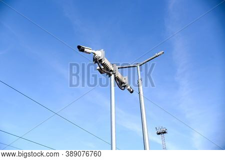 Cctv Cameras Mounted On A Pole, Blue Sky Background. Two Video Cameras For Outdoor Surveillance.