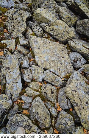 A Pile Of Large Stones, With The Stones Overgrown With Moss, Qurum.