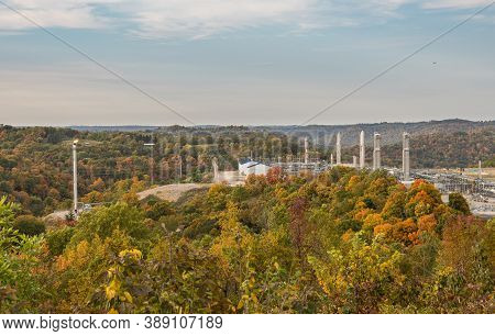Overview Of Natural Gas Fracking Pad Near Moundsville West Virginia In The Fall With Autumn Trees