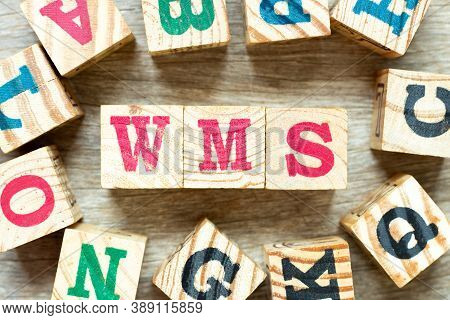 Alphabet Letter Block In Word Wms (abbreviation Of Warehouse Management System) With Another On Wood
