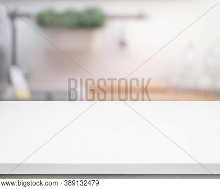 Selective Focus/white Table Top On Blur Kitchen Counter (room)background.for Montage Product Display