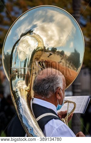 Padua, Italy - Sept 27, 2020: Close-up Of A Musician Of A Brass Band Playing The Tuba Sousaphone Dur