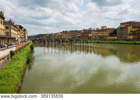 Flornce, Italy - April 24, 2019: View Of The Historic Buildings In Florence. Reflection In The River