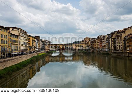 Flornce, Italy - April 24, 2019: Ponte Vecchio. View Of The Historic Buildings In Florence. Reflecti