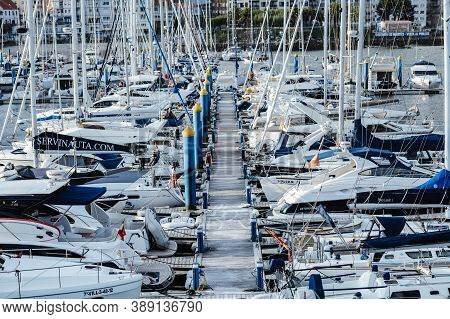 Sanxenxo, Spain - August 18, 2020: Small Sailing Boats Moored In The Yacht Club Of Sanxenxo On A Cle