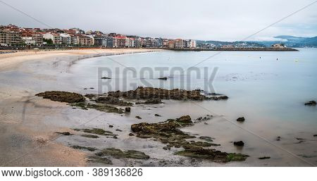 Panorama View Of Sanxenxo And Silgar Beach At The End Of A Cloudy Summer Day In The Rias Baixas In G