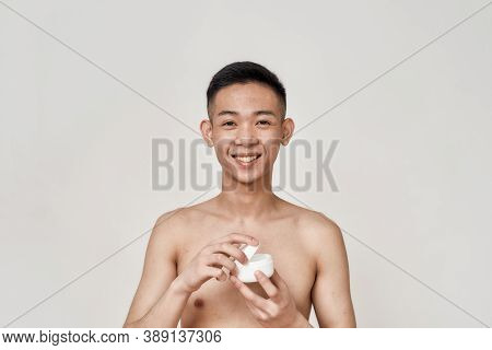 Portrait Of Young Asian Man With Problematic Skin And Hyperpigmentation On His Face Smiling At Camer