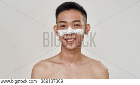 Portrait Of Shirtless Young Asian Man With Problematic Skin And Hyperpigmentation Applied Mask On Hi