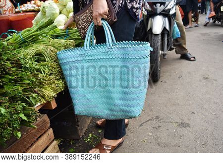 Bengkulu, Indonesia - October 11, 2020: Woman Holding Plastic Bag Buying Vegetables And Food At The 
