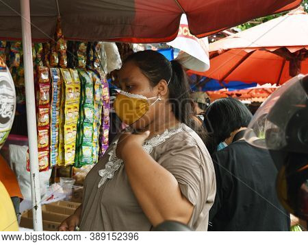 Bengkulu, Indonesia - October 11, 2020: Asian Woman Wearing Face Mask In Traditional Markets In The 