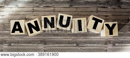 Word Annuity On Wooden Cubes And Brown Background