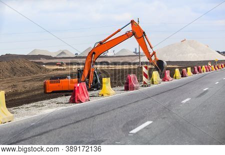 Excavator On The Construction Of A New Multilane Highway