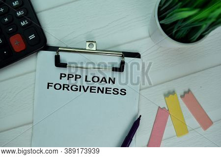 Ppp Loan Forgiveness Write On A Paperwork Isolated On Office Desk.