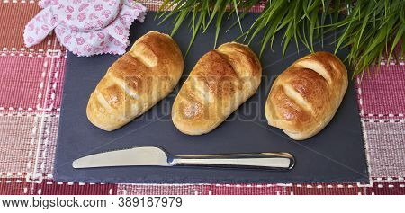 Delicious Golden Milk Bread Buns Handmade In The Traditional Style And In A Natural Way On A Gray Sl