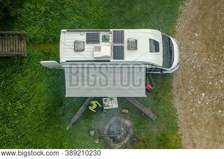Recreational Vehicle Campground Rv Park Pitch With Modern Camper Van Equipped With Solar Panels And 