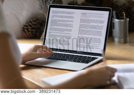 Close Up Opened Computer With Electronic Documents On Screen.