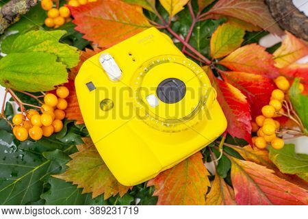 August 29, 2020, Rostov, Russia: Instant Camera Fujifilm Instax Mini 9 Lies On Colorful Autumn Leave