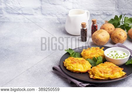 Fried Cakes Of Grated Potatoes On The Plate With Sauce. Traditional Pancakes Boxty Raggmunk.