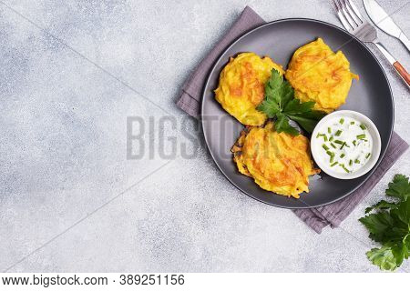 Fried Cakes Of Grated Potatoes On The Plate With Sauce. Traditional Pancakes Boxty Raggmunk.