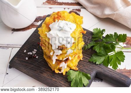 Fried Cakes Of Grated Potatoes On The Plate With Sauce. Traditional Pancakes Boxty Raggmunk.