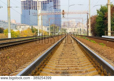 Modern Railroad Track Of Multi-track Railway On A Background Of Urban Structures, Close-up At Shallo
