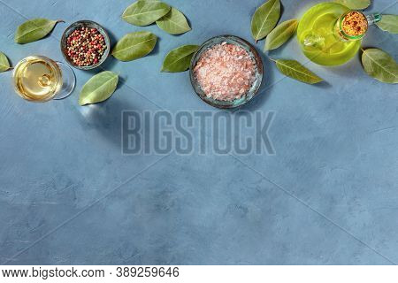 Cooking Banner With A Place For Text. Salt, Pepper, Olive Oil, Wine, Bay Leaves, Shot From Above On 