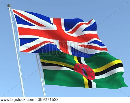 Two Waving State Flags Of United Kingdom And Dominica On The Blue Sky. High - Quality Business Backg
