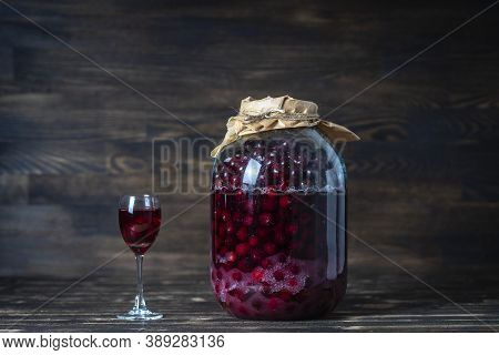 Homemade Tincture Of Red Cherry. Berry Alcoholic Drinks Concept. Red Wine Made From Ripe Cherries In